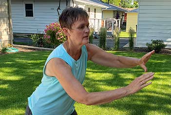 Jane doing tai ji quan in back yard