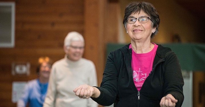 Older woman exercising in a SAIL class