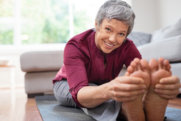 Older woman doing exercises and smiling