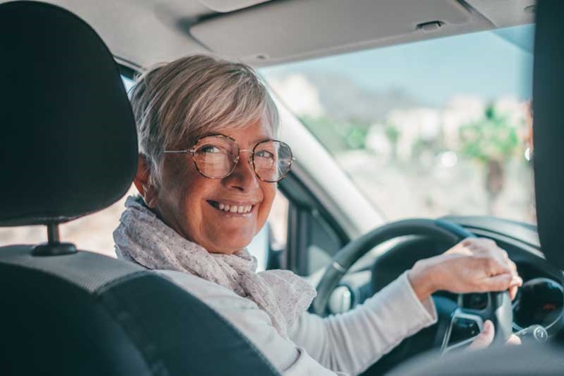 Woman smiling in car