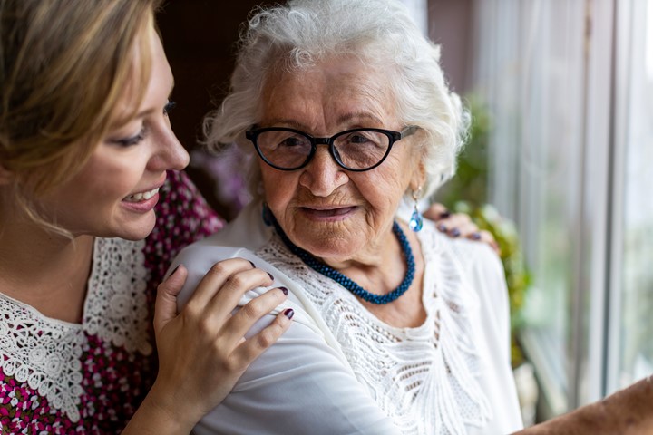 Older woman with her granddaughter, her caretaker