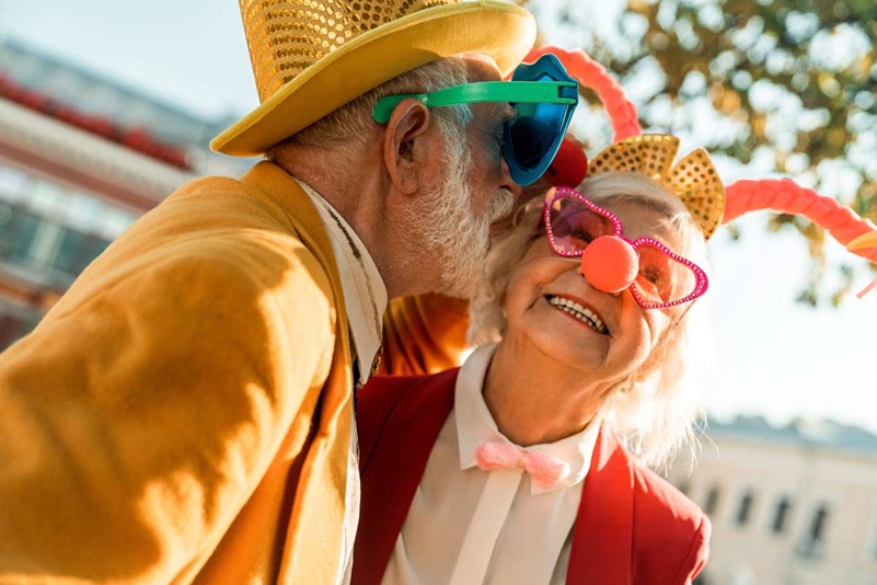 Couple laughing together in wild customs