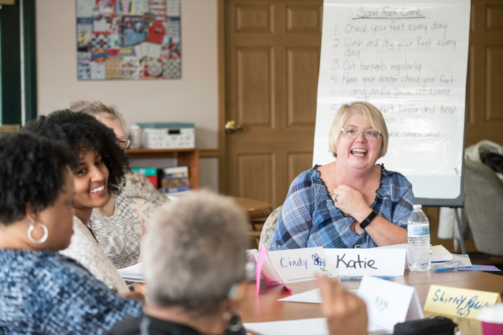 Woman leading conversation about health conditions