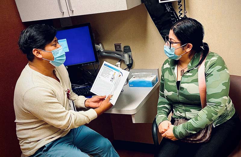 Juan Perez with a patient at Sanford Worthington Medical Center
