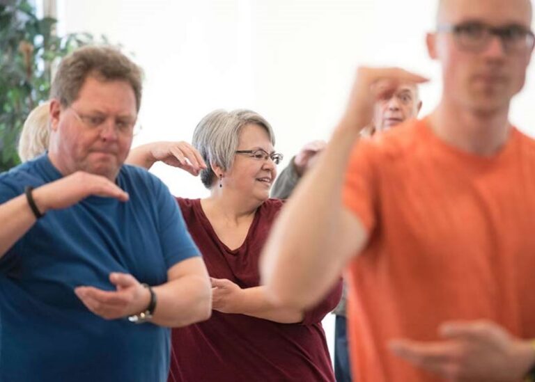 Older adults practicing tai chi.